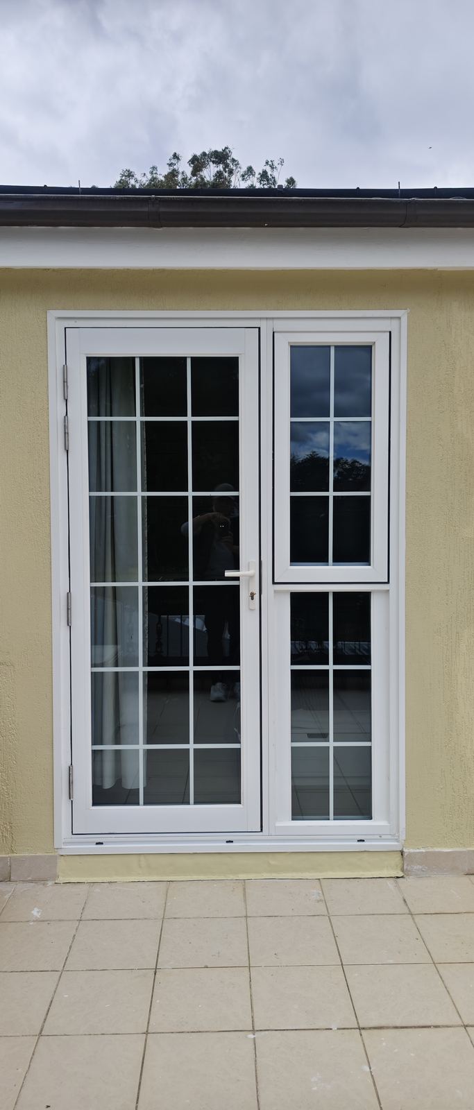 White aluminium French hinged door with sidelight and grid bars